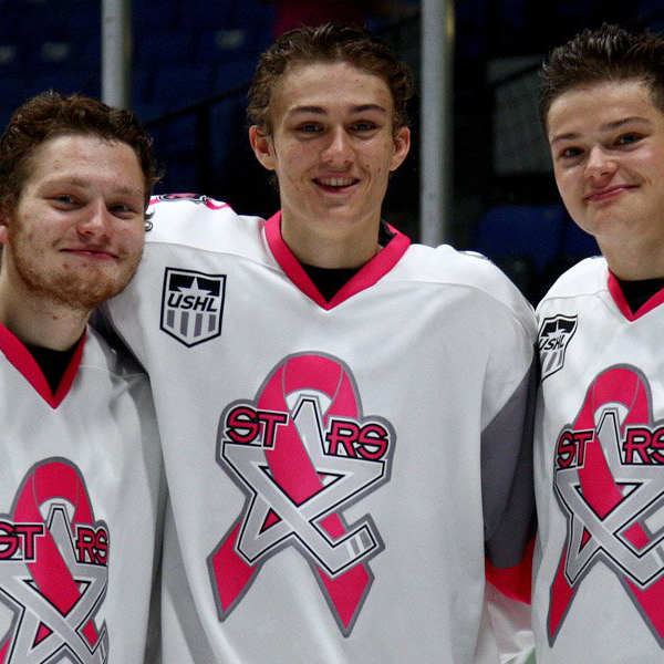 hockey players supporting pink