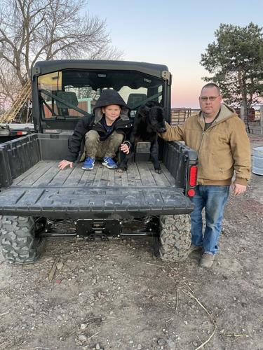 AgrAbility client and son on farm