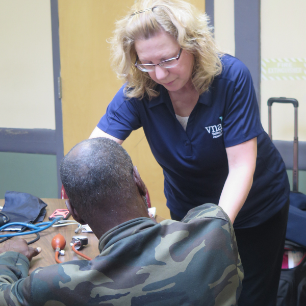 VNA shelter nurse with client